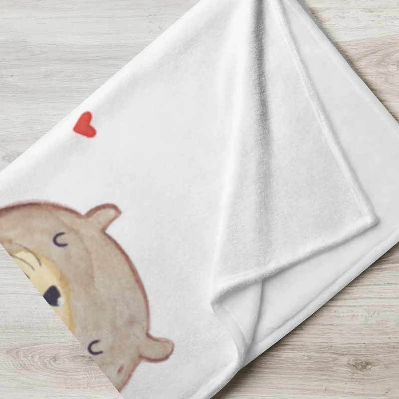 Babydecke Otter Hände halten